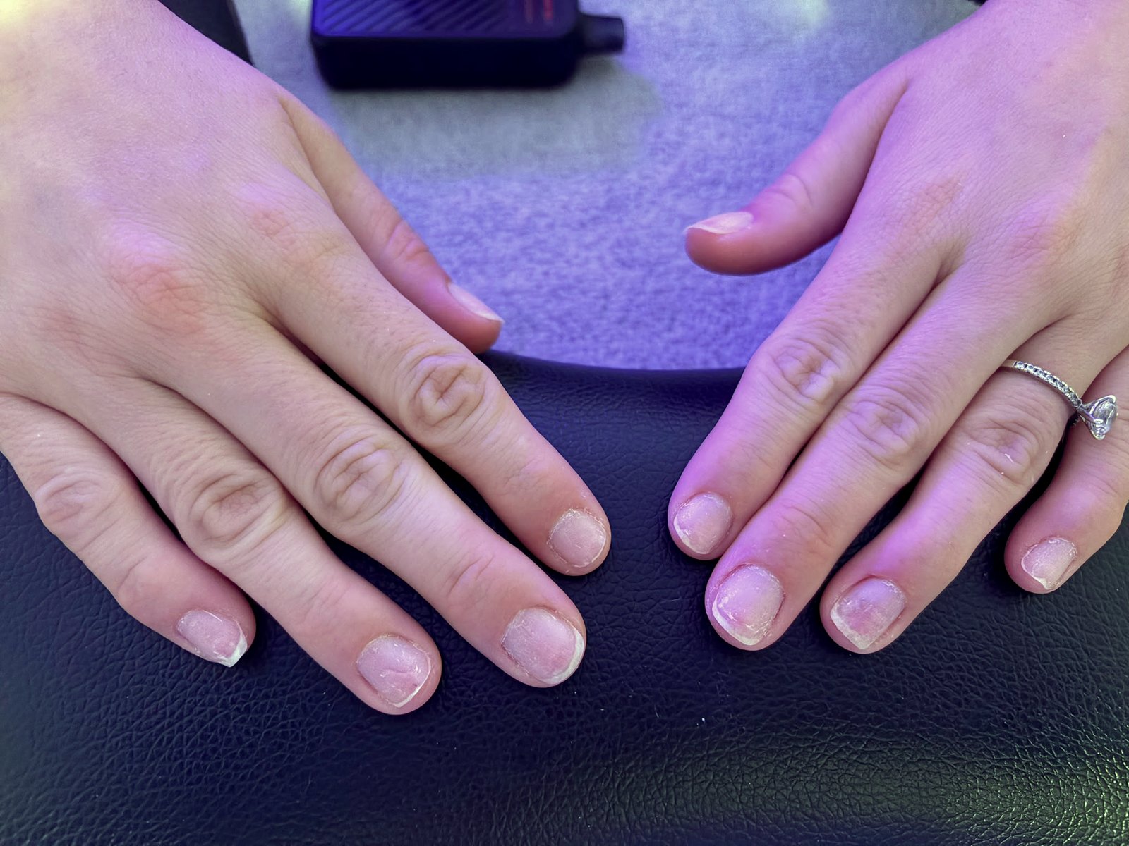 Freshly finished natural manicure — both hands, July 2026 client