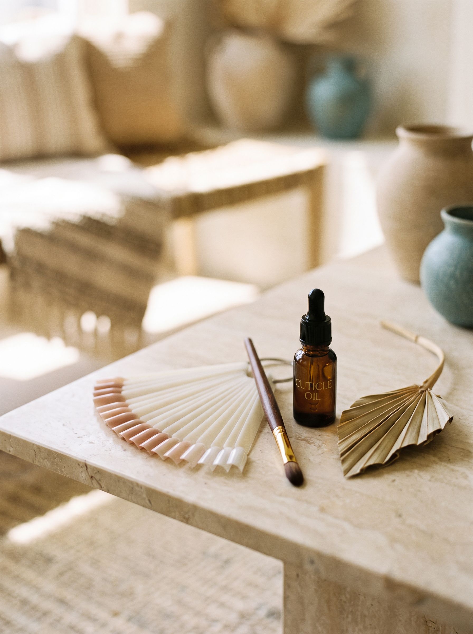 Nail tips and detail brush on marble